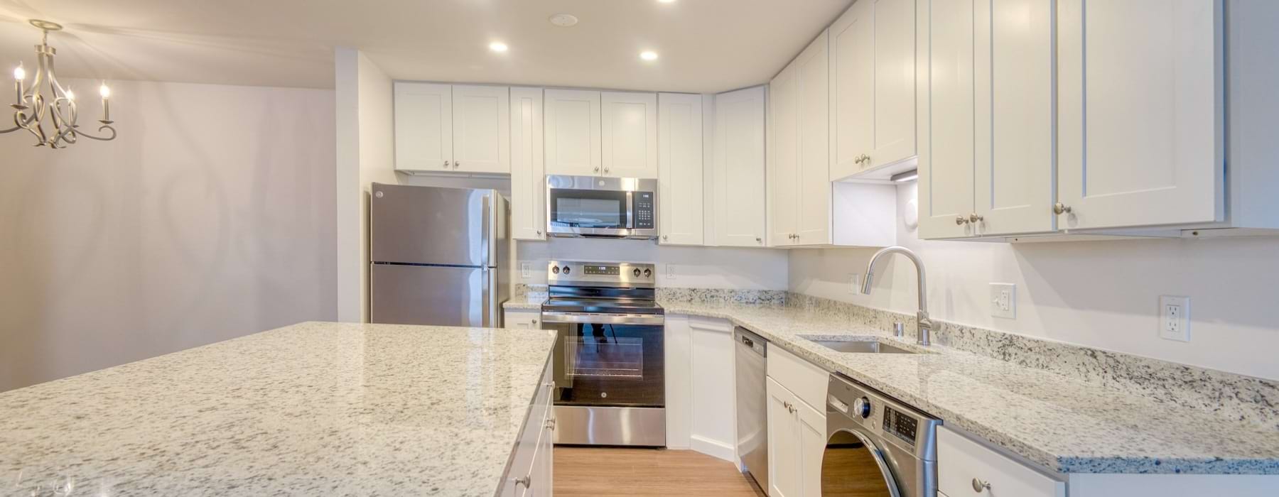 a kitchen with white cabinets