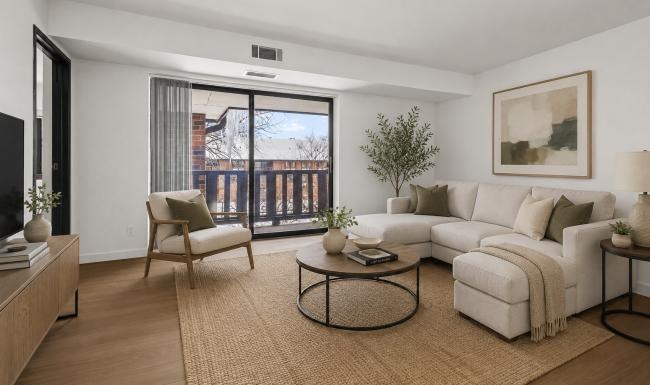 a living room with a couch, chair and a coffee table